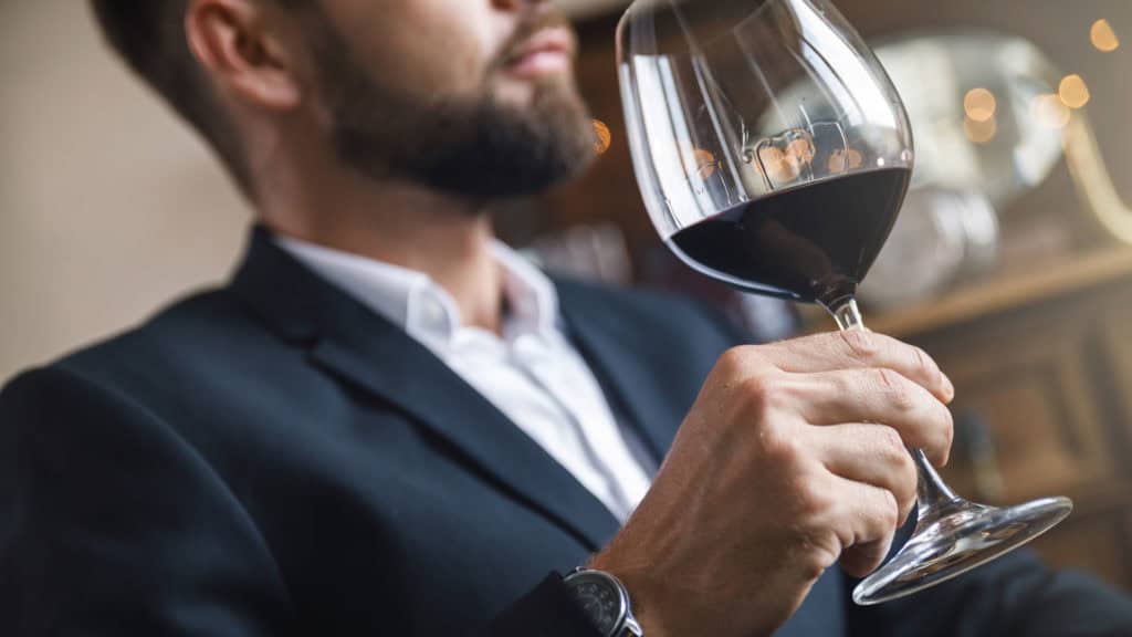 Man holding red wine glass, final finish, bright ambience