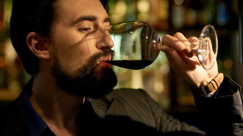 Man drinks red wine and experiences the final finish