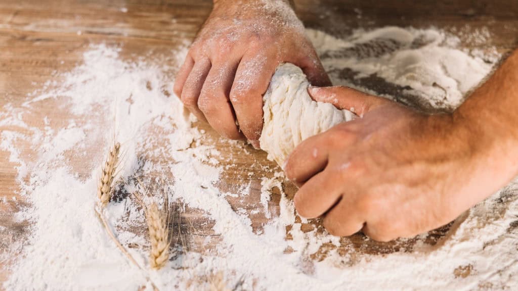 Bakers preparing the dough for Valais rye bread - an artisanal process