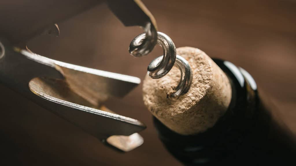 Uncorking a wine bottle - Professional opening of a red wine bottle
