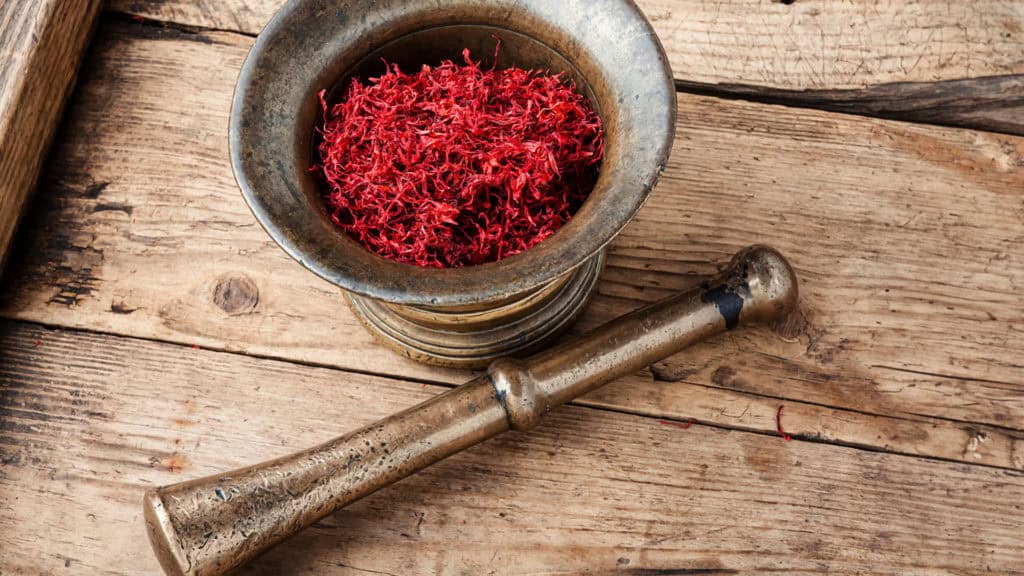 Saffron in a mortar - grinding fresh threads for recipes