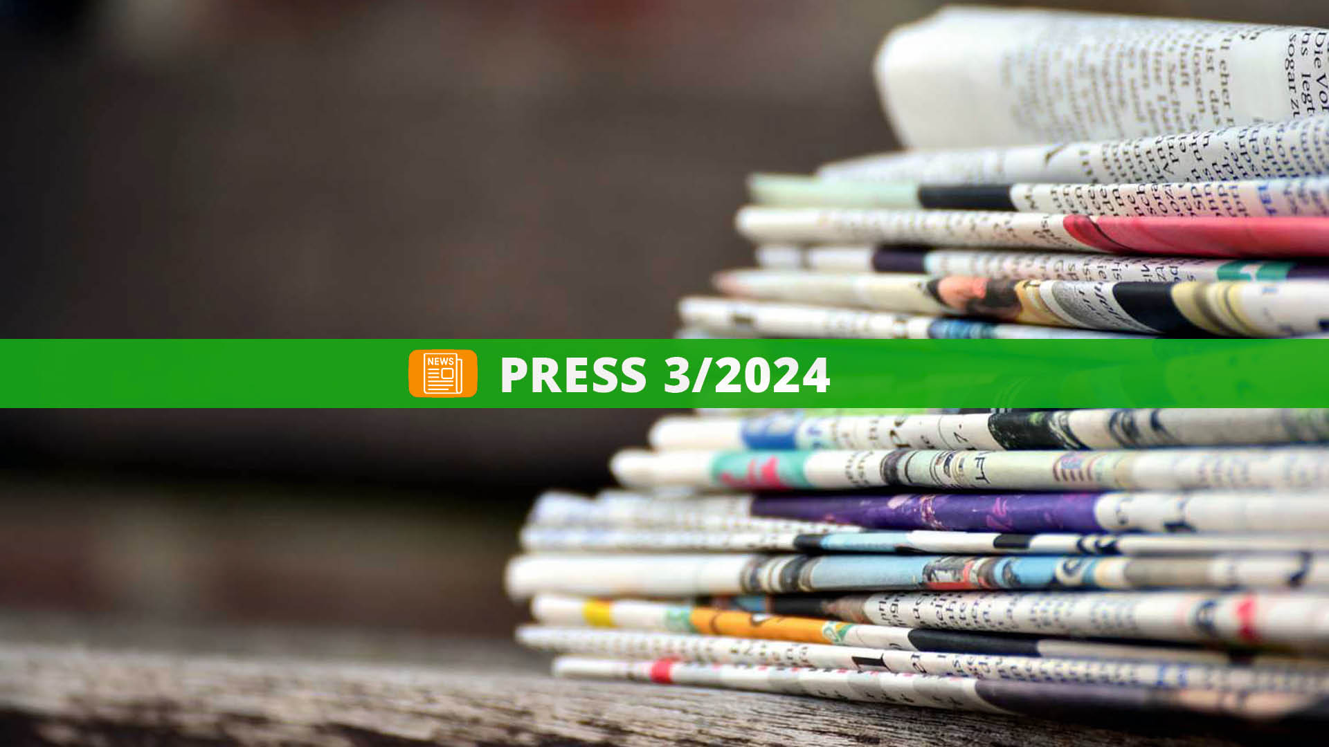 a stack of newspapers on a table